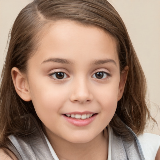 Joyful white child female with long  brown hair and brown eyes