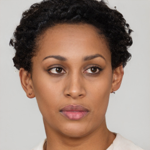 Neutral latino young-adult female with short  black hair and brown eyes