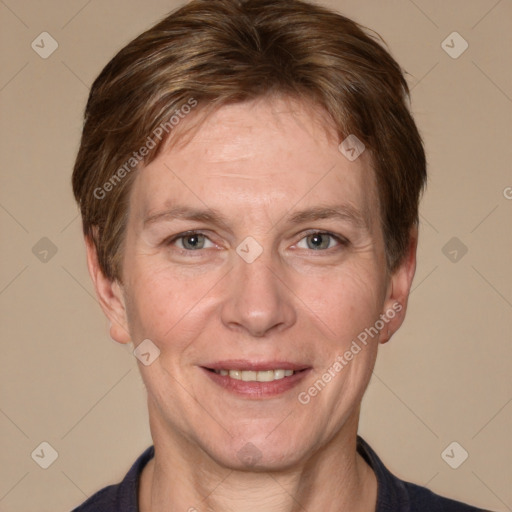 Joyful white adult female with short  brown hair and grey eyes