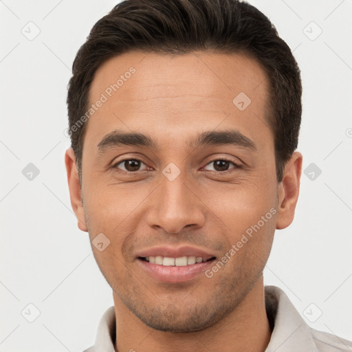 Joyful white young-adult male with short  brown hair and brown eyes