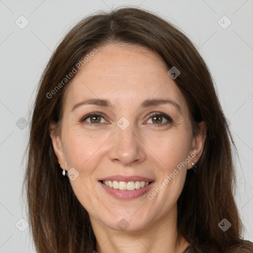 Joyful white adult female with long  brown hair and grey eyes