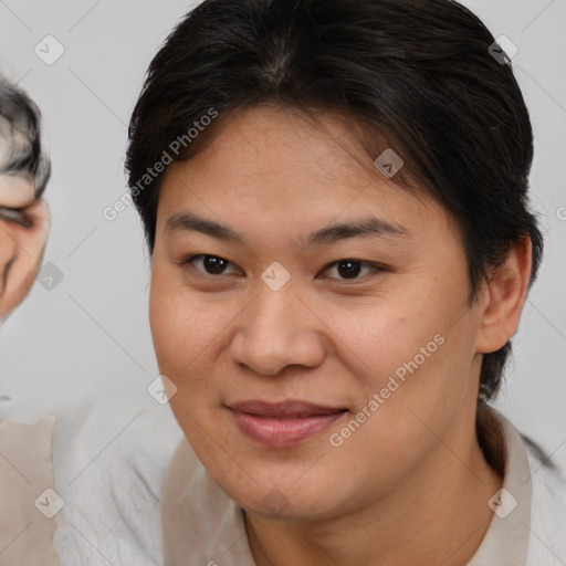 Joyful asian young-adult female with medium  brown hair and brown eyes