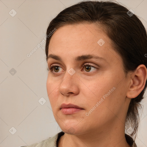 Neutral white young-adult female with medium  brown hair and brown eyes