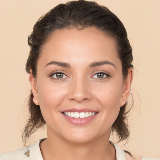 Joyful white young-adult female with medium  brown hair and brown eyes