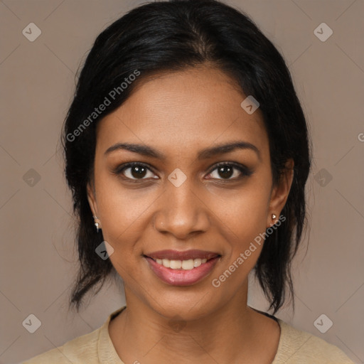 Joyful black young-adult female with medium  brown hair and brown eyes