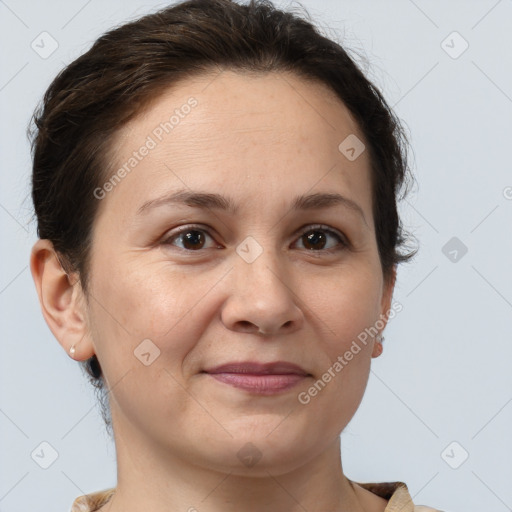 Joyful white adult female with short  brown hair and brown eyes