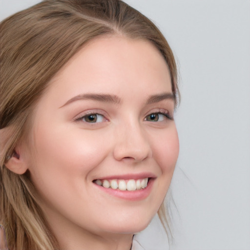 Joyful white young-adult female with long  brown hair and blue eyes