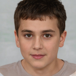 Joyful white child male with short  brown hair and brown eyes