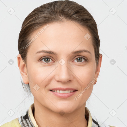 Joyful white young-adult female with short  brown hair and grey eyes