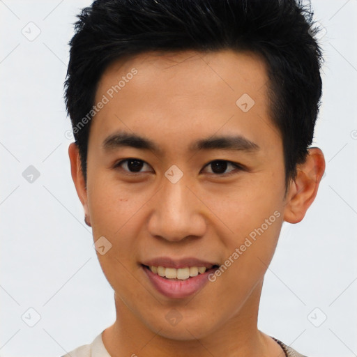 Joyful asian young-adult male with short  brown hair and brown eyes