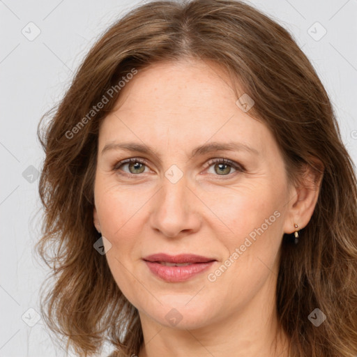 Joyful white adult female with long  brown hair and brown eyes