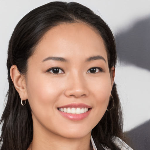 Joyful white young-adult female with long  black hair and brown eyes