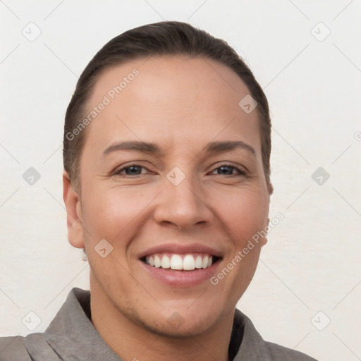 Joyful white young-adult female with short  brown hair and brown eyes