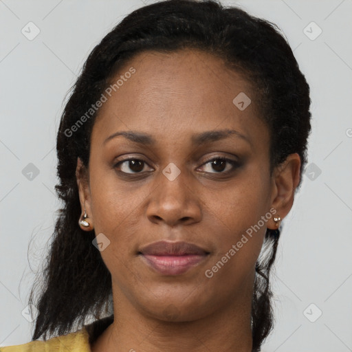 Joyful black young-adult female with short  brown hair and brown eyes