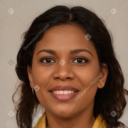 Joyful black young-adult female with long  brown hair and brown eyes