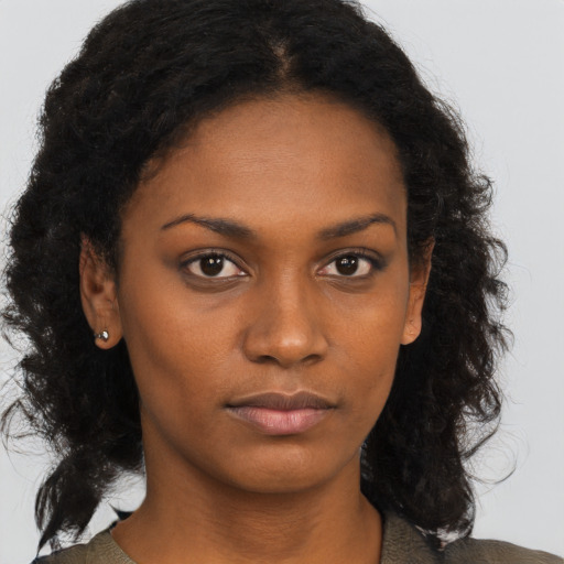 Neutral black young-adult female with long  brown hair and brown eyes