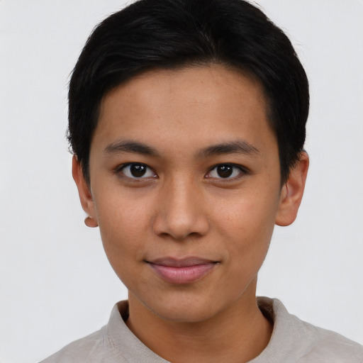 Joyful asian young-adult female with short  brown hair and brown eyes