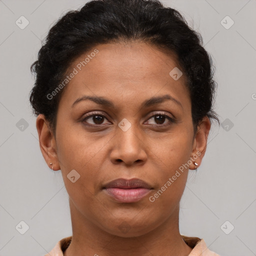 Joyful latino adult female with short  brown hair and brown eyes