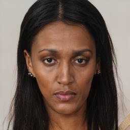 Neutral black young-adult female with long  brown hair and brown eyes