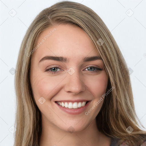 Joyful white young-adult female with long  brown hair and green eyes