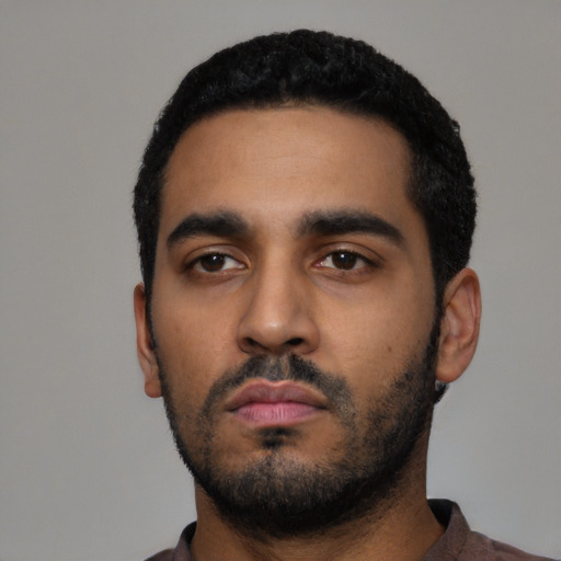 Neutral black young-adult male with short  black hair and brown eyes