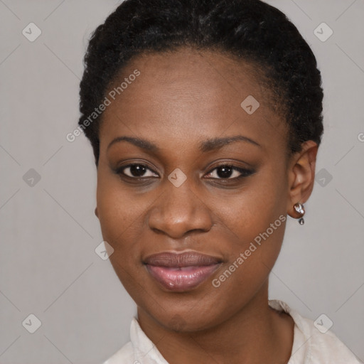 Joyful black young-adult female with short  brown hair and brown eyes