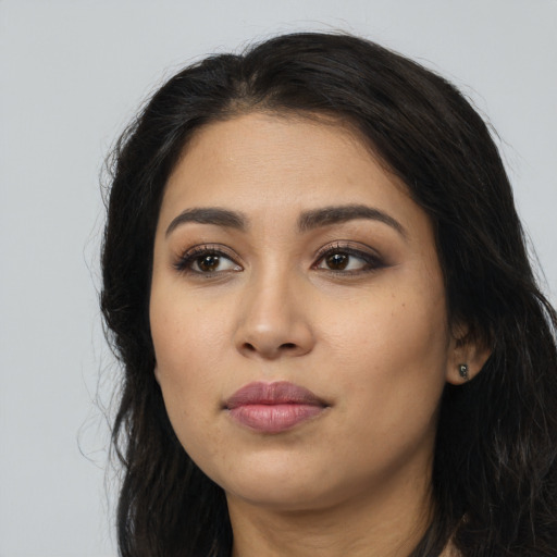 Neutral latino young-adult female with long  black hair and brown eyes