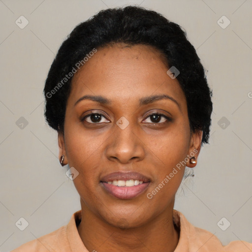 Joyful black young-adult female with short  black hair and brown eyes