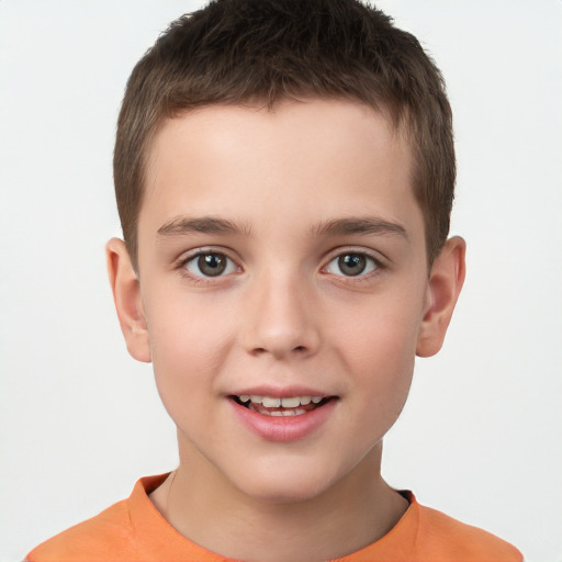 Joyful white child male with short  brown hair and brown eyes