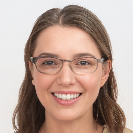 Joyful white young-adult female with long  brown hair and grey eyes