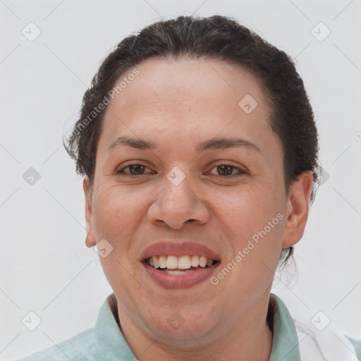 Joyful white adult female with short  brown hair and brown eyes