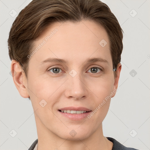 Joyful white young-adult female with short  brown hair and grey eyes