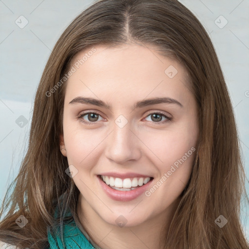 Joyful white young-adult female with long  brown hair and green eyes