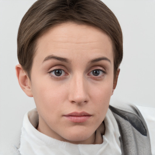 Neutral white young-adult female with short  brown hair and grey eyes