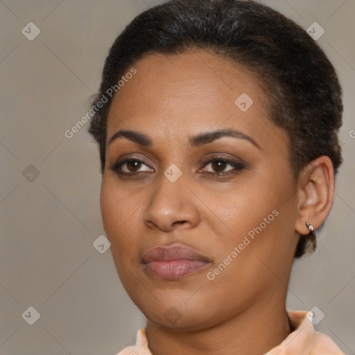 Joyful black young-adult female with short  brown hair and brown eyes