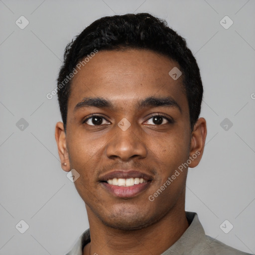 Joyful black young-adult male with short  black hair and brown eyes