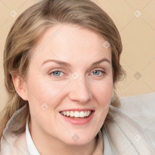 Joyful white young-adult female with medium  brown hair and blue eyes