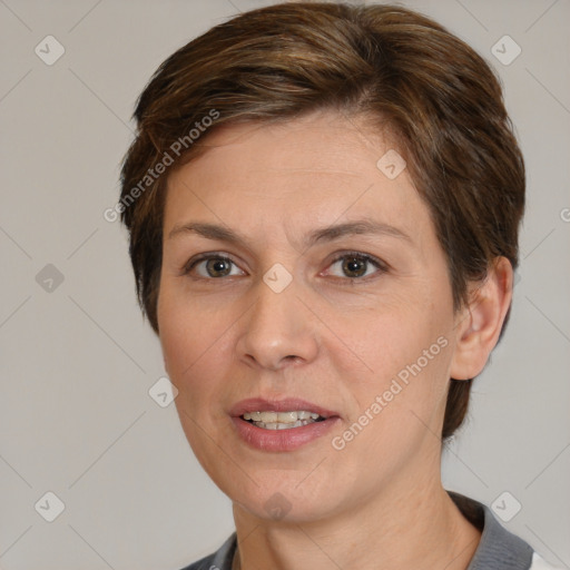 Joyful white adult female with short  brown hair and brown eyes