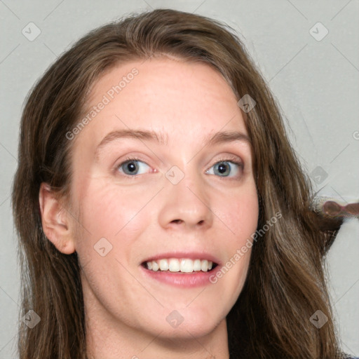 Joyful white young-adult female with long  brown hair and grey eyes