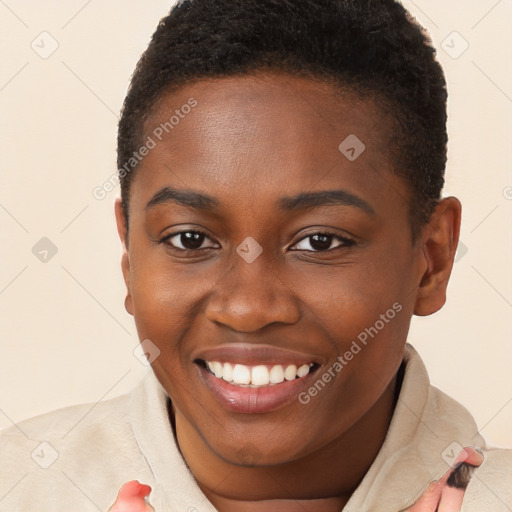 Joyful black young-adult female with short  brown hair and brown eyes