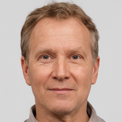 Joyful white middle-aged male with short  brown hair and brown eyes