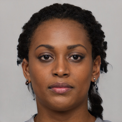 Neutral black young-adult female with long  black hair and brown eyes