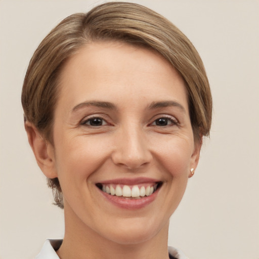 Joyful white young-adult female with short  brown hair and brown eyes