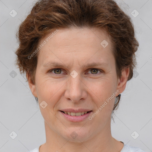 Joyful white adult female with short  brown hair and brown eyes