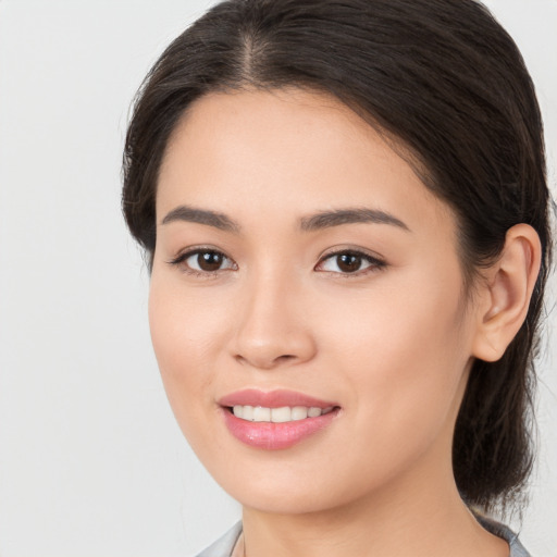 Joyful white young-adult female with medium  brown hair and brown eyes