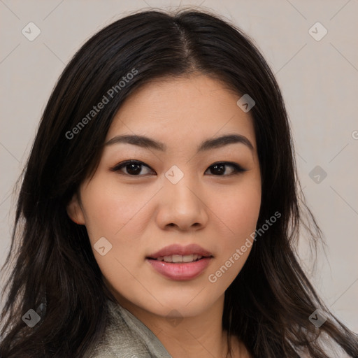 Joyful asian young-adult female with long  black hair and brown eyes