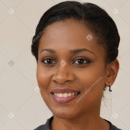 Joyful black young-adult female with medium  brown hair and brown eyes