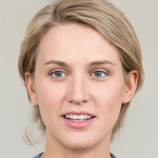 Joyful white young-adult female with medium  brown hair and blue eyes