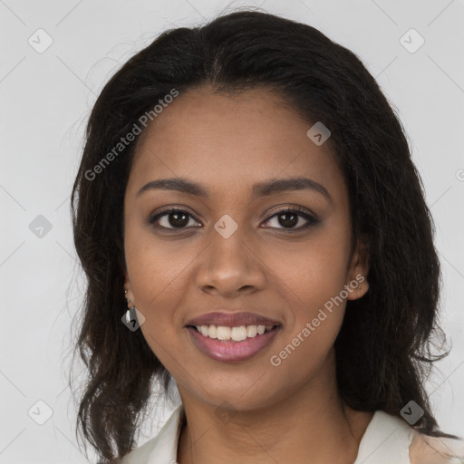 Joyful black young-adult female with long  brown hair and brown eyes