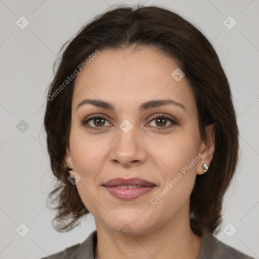 Joyful white adult female with medium  brown hair and brown eyes